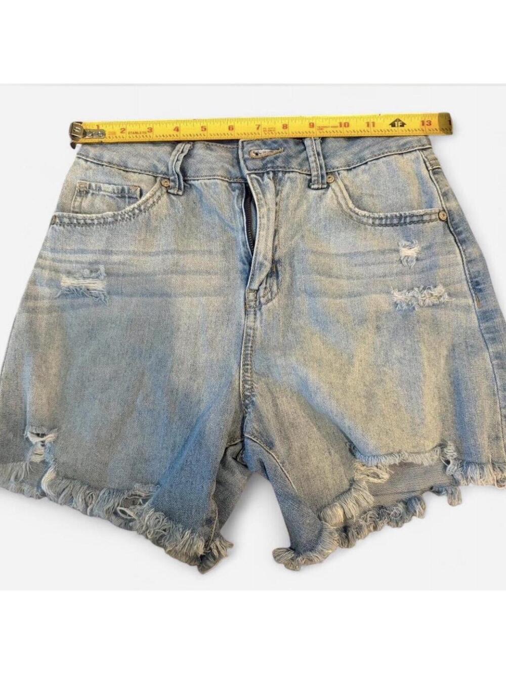 Light wash denim shorts with frayed hem and button fly #denimshorts